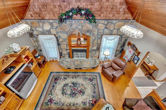 living room with wood-type flooring, vaulted ceiling, and wood ceiling