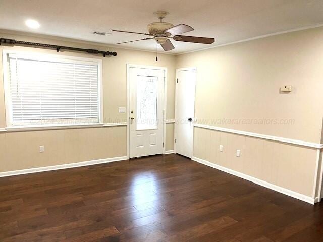 foyer entrance featuring dark hardwood / wood-style floors, ceiling fan, and ornamental molding