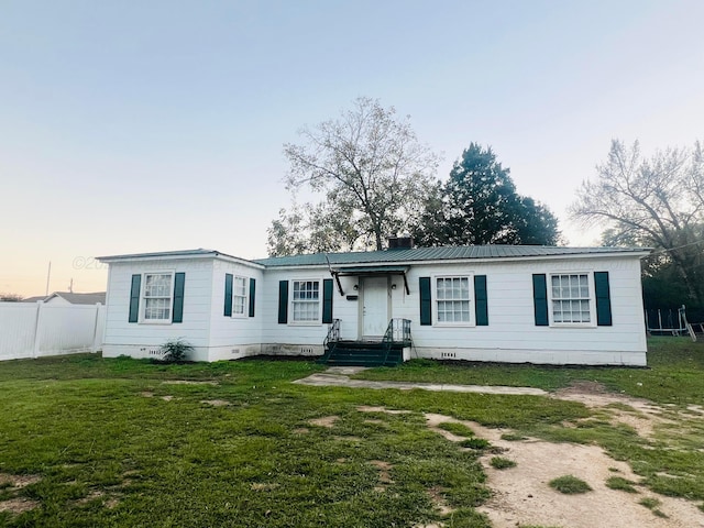 ranch-style house with a lawn