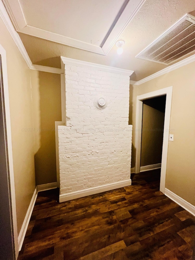 interior space featuring dark hardwood / wood-style flooring and ornamental molding