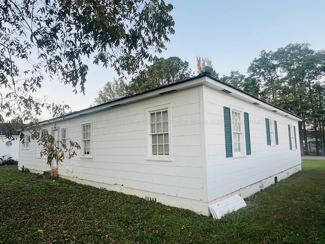 view of property exterior featuring a yard