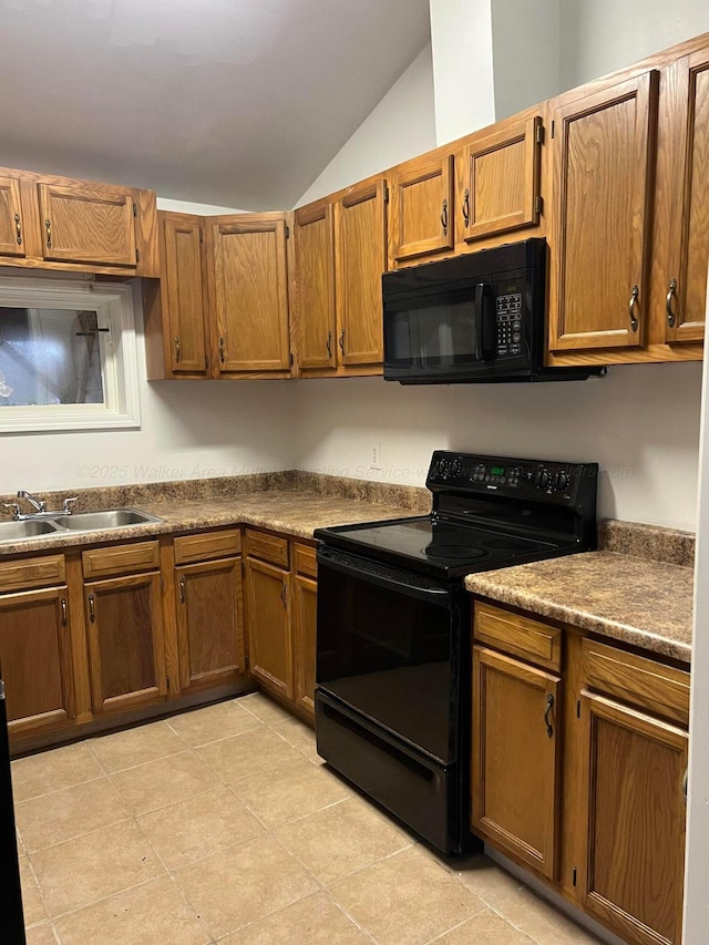 kitchen featuring lofted ceiling, sink, and black appliances