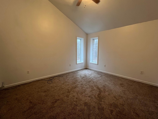 spare room with high vaulted ceiling, ceiling fan, and carpet flooring