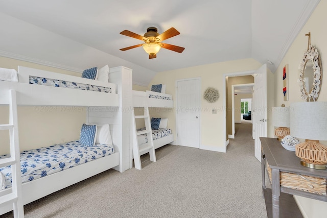 bedroom with carpet flooring, ceiling fan, and vaulted ceiling