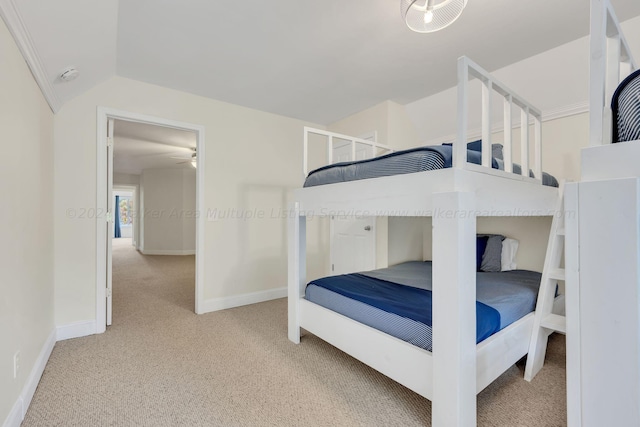 carpeted bedroom with vaulted ceiling