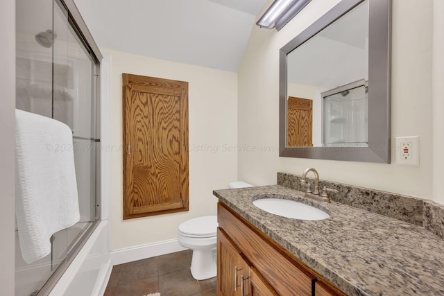 full bathroom featuring tile patterned floors, vanity, toilet, and shower / bath combination with glass door