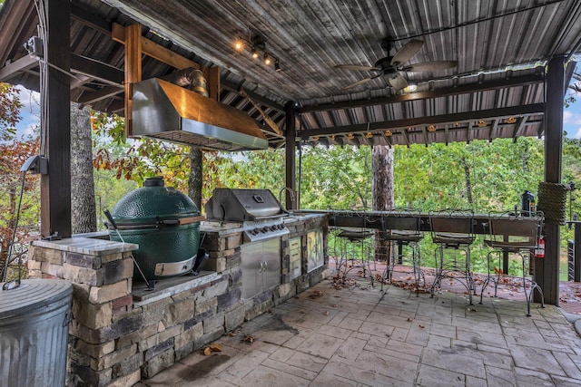 view of patio with a gazebo, area for grilling, ceiling fan, and a grill