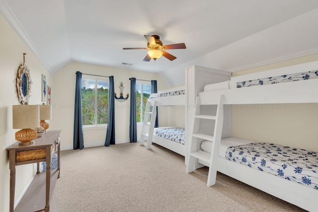 carpeted bedroom with ceiling fan and lofted ceiling