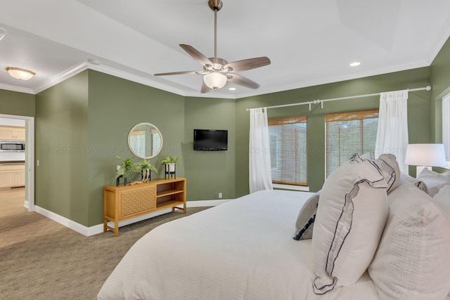 carpeted bedroom featuring multiple windows, ceiling fan, and ornamental molding