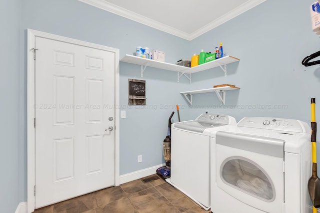 laundry room with separate washer and dryer and crown molding