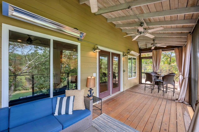 sunroom featuring vaulted ceiling with beams and wood ceiling