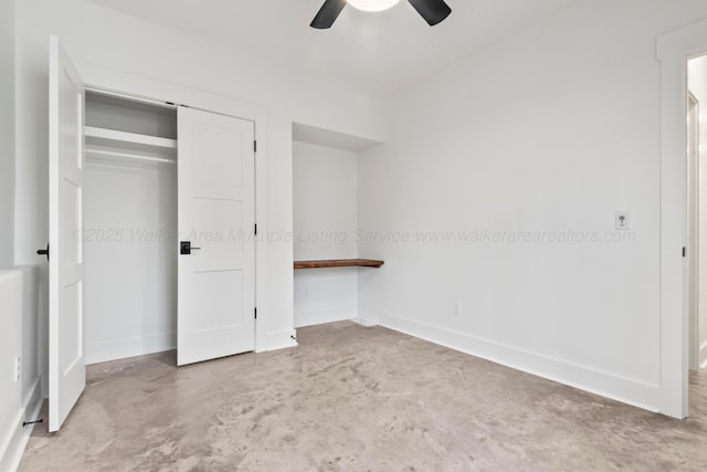 unfurnished bedroom featuring baseboards, a closet, concrete floors, and ceiling fan