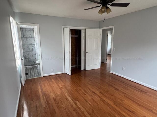 314 Crescent Cir, Jasper, AL 35503 - unfurnished bedroom featuring connected bathroom, a closet, wood finished floors, baseboards, and ceiling fan