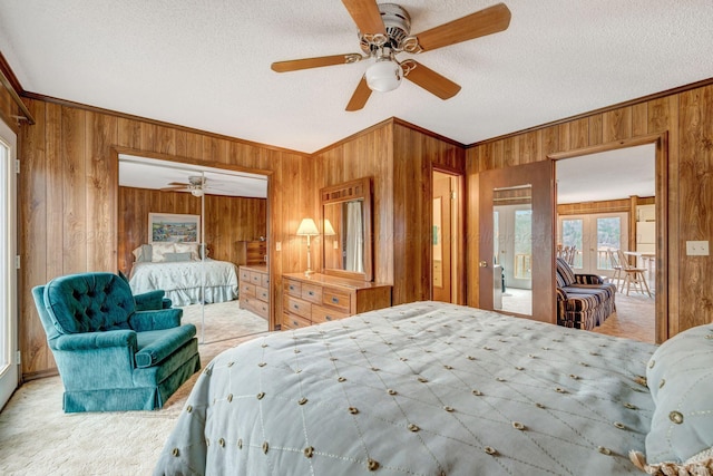 bedroom featuring carpet, wood walls, and crown molding