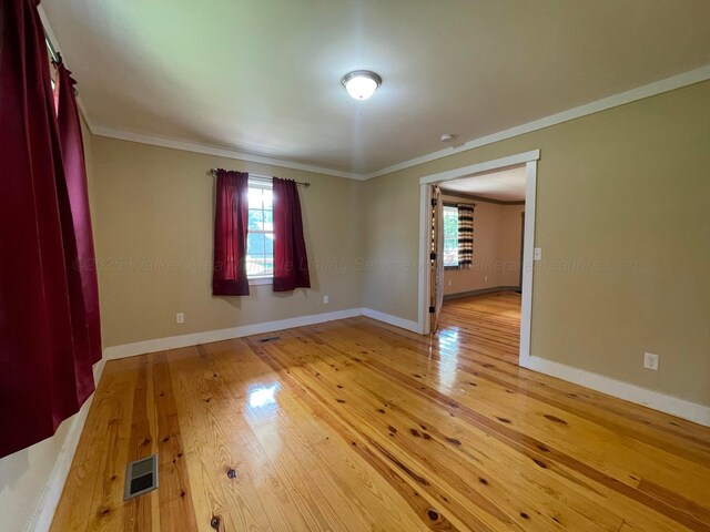 4694 County Road 1718, Holly Pond, AL 35083 - empty room with crown molding and light wood finished floors