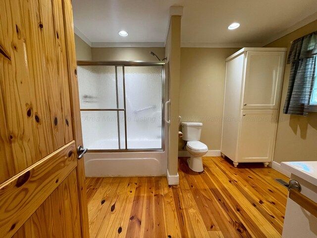 4694 County Road 1718, Holly Pond, AL 35083 - bathroom featuring wood finished floors, shower / bath combination with glass door, and recessed lighting