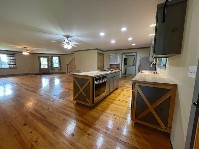 4694 County Road 1718, Holly Pond, AL 35083 - kitchen with stainless steel appliances, light wood-type flooring, a center island, light countertops, and recessed lighting