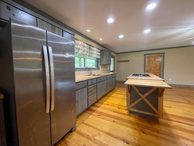 4694 County Road 1718, Holly Pond, AL 35083 - kitchen with stainless steel appliances, light wood-style floors, gray cabinetry, recessed lighting, and crown molding