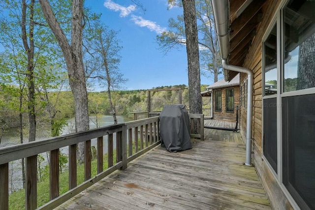 wooden terrace with a water view