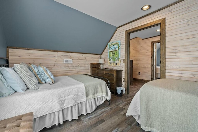 bedroom featuring recessed lighting, dark wood finished floors, lofted ceiling, and wood walls