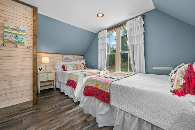 bedroom with recessed lighting, lofted ceiling, and wood finished floors