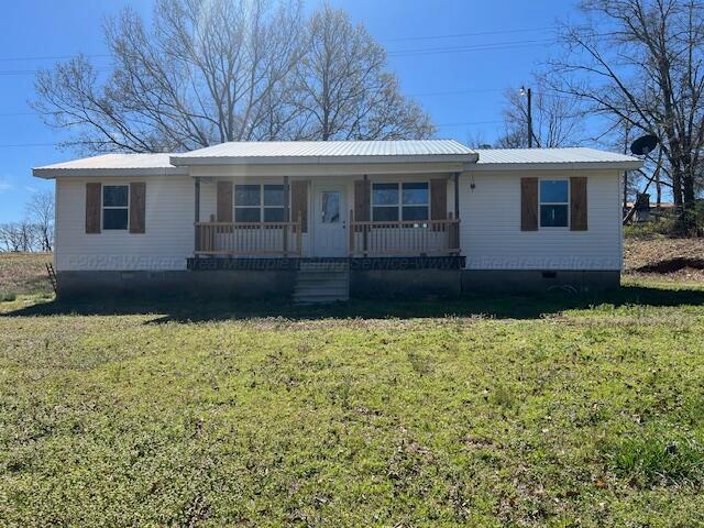 view of front of property with crawl space, metal roof, a front yard, and covered porch