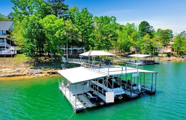 187 S Pointe Dr, Arley, AL 35541 - dock area featuring boat lift, a water view, and view of scattered trees