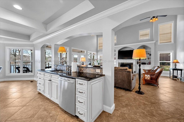 187 S Pointe Dr, Arley, AL 35541 - kitchen with dishwasher, a sink, dark countertops, open floor plan, and light tile patterned floors