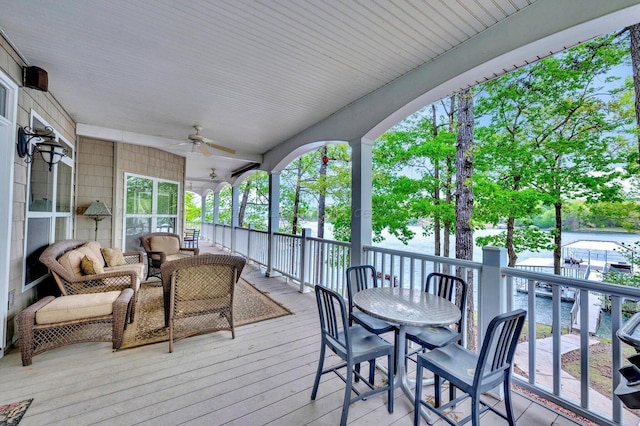 187 S Pointe Dr, Arley, AL 35541 - wooden terrace featuring a ceiling fan and outdoor dining area