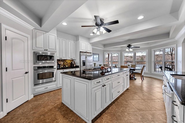 187 S Pointe Dr, Arley, AL 35541 - kitchen featuring stainless steel appliances, a tray ceiling, decorative backsplash, ceiling fan, and recessed lighting