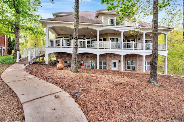 187 S Pointe Dr, Arley, AL 35541 - back of house with roof with shingles, stairway, brick siding, and ceiling fan