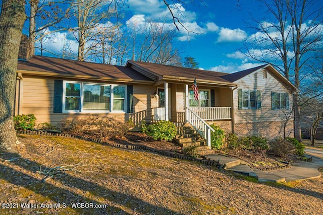 ranch-style house featuring covered porch