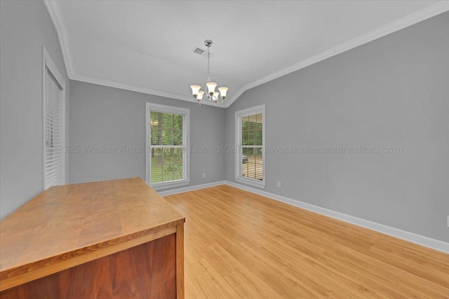 526 Boat Launch Rd, Quinton, AL 35130 - unfurnished dining area with ornamental molding, light wood finished floors, a chandelier, and vaulted ceiling