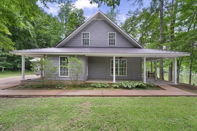 526 Boat Launch Rd, Quinton, AL 35130 - country-style home featuring a porch, a front lawn, and a metal roof