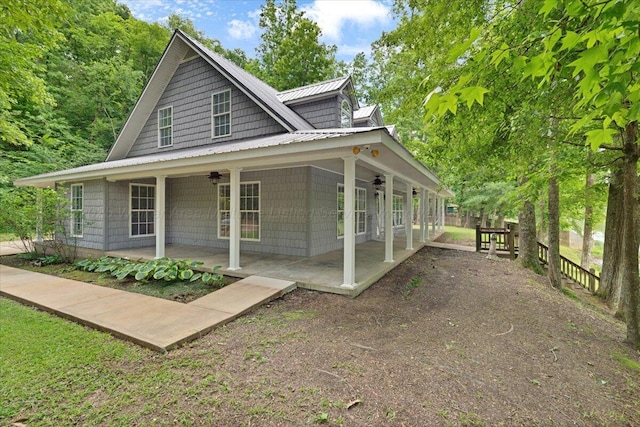 526 Boat Launch Rd, Quinton, AL 35130 - view of front facade with a ceiling fan, a patio, a metal roof, and a standing seam roof