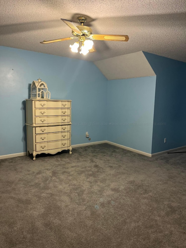additional living space with lofted ceiling, a textured ceiling, a ceiling fan, and carpet floors