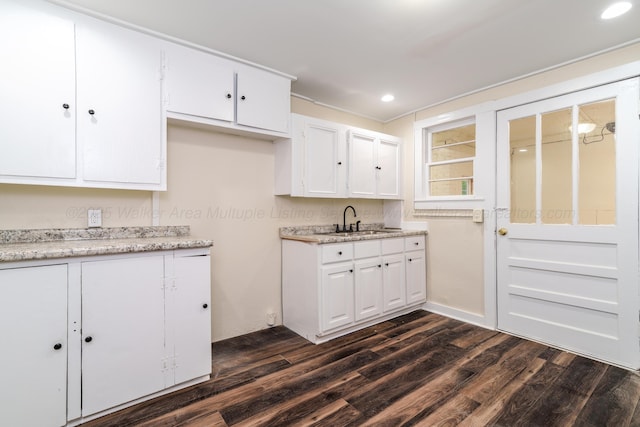409 W 13th St, Jasper, AL 35501 - kitchen with a sink, dark wood finished floors, white cabinets, light countertops, and recessed lighting