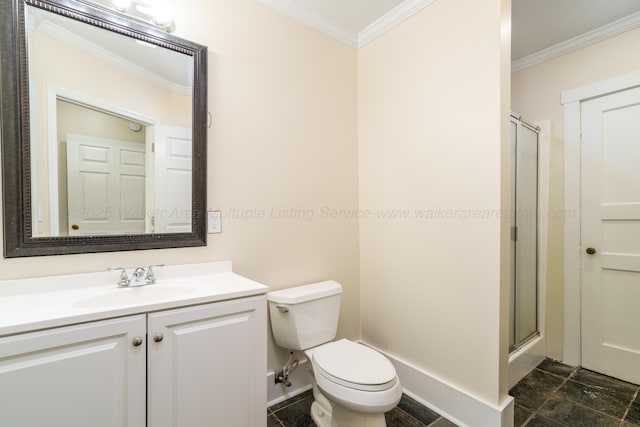 409 W 13th St, Jasper, AL 35501 - bathroom with ornamental molding, a shower with shower door, vanity, toilet, and baseboards