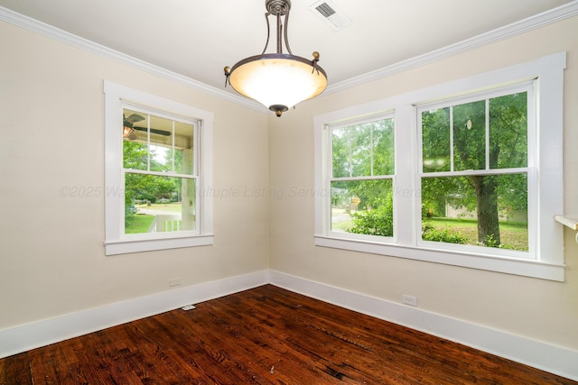 409 W 13th St, Jasper, AL 35501 - empty room with healthy amount of natural light, ornamental molding, baseboards, and dark wood-style flooring