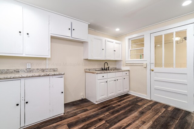 409 W 13th St, Jasper, AL 35501 - kitchen with a sink, dark wood finished floors, white cabinets, light countertops, and recessed lighting