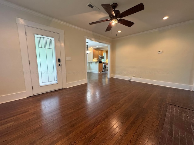 foyer entrance featuring crown molding, visible vents, baseboards, ceiling fan, and dark wood-type flooring