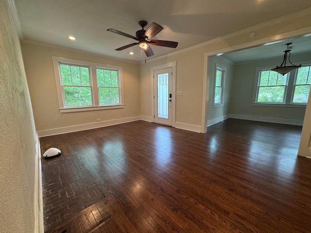 unfurnished room featuring crown molding, a ceiling fan, and baseboards