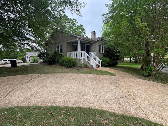 view of front of property featuring a chimney