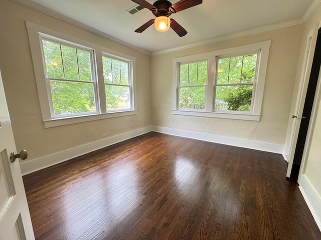 unfurnished room featuring a ceiling fan, baseboards, dark wood finished floors, and a wealth of natural light