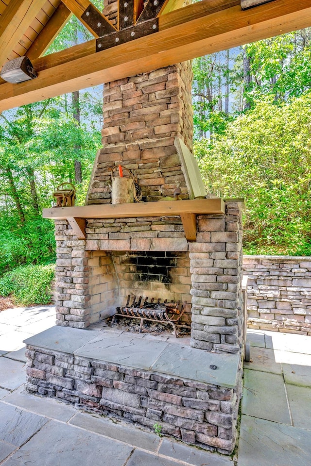 view of patio / terrace with an outdoor stone fireplace