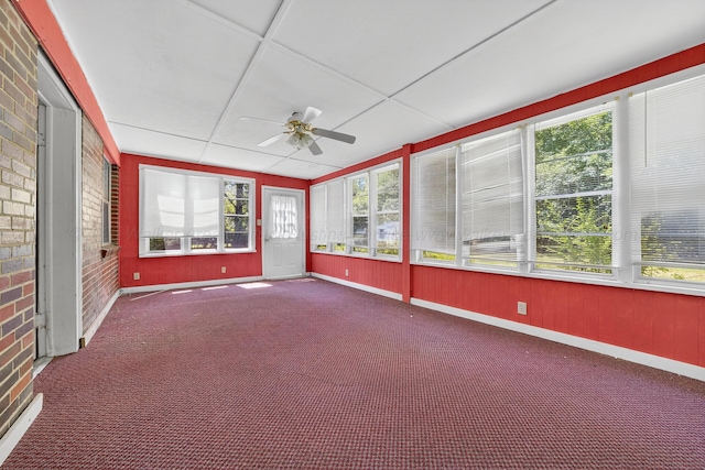 3209 Elm St, Adamsville, AL 35005 - unfurnished sunroom featuring ceiling fan, brick wall, healthy amount of natural light, and carpet