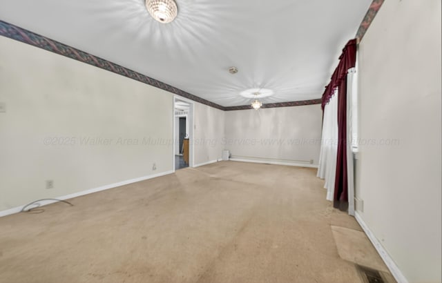 3209 Elm St, Adamsville, AL 35005 - carpeted spare room featuring baseboards and baseboard heating