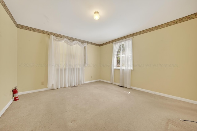 3209 Elm St, Adamsville, AL 35005 - carpeted empty room featuring baseboards