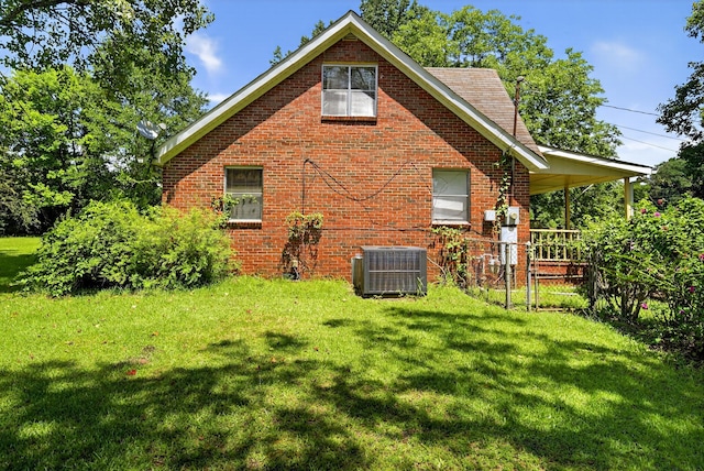 3209 Elm St, Adamsville, AL 35005 - back of house with a yard and brick siding