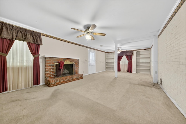 3209 Elm St, Adamsville, AL 35005 - unfurnished living room with a ceiling fan, carpet floors, ornamental molding, built in shelves, and a fireplace